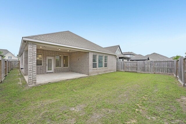 18314 Pedernales Springs Dr, Cypress, TX 77433 - rear view of house with brick siding, a fenced backyard, and a patio area