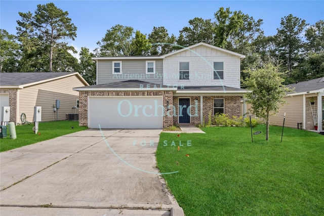 15689 Del Norte Dr, Conroe, TX 77306 - view of front facade featuring brick siding, driveway, a front lawn, and a garage