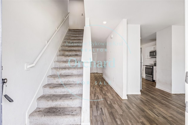 15689 Del Norte Dr, Conroe, TX 77306 - stairs with wood finished floors and baseboards