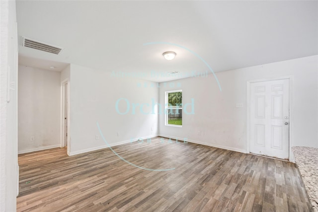 15689 Del Norte Dr, Conroe, TX 77306 - empty room featuring wood finished floors and baseboards