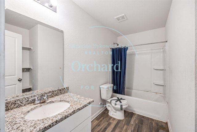 15689 Del Norte Dr, Conroe, TX 77306 - full bathroom featuring wood finished floors, vanity, and shower / bath combo with shower curtain