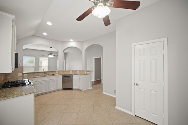 13003 Castlewind Ln, Pearland, TX 77584 - kitchen featuring ceiling fan, dishwasher, arched walkways, white cabinetry, and recessed lighting
