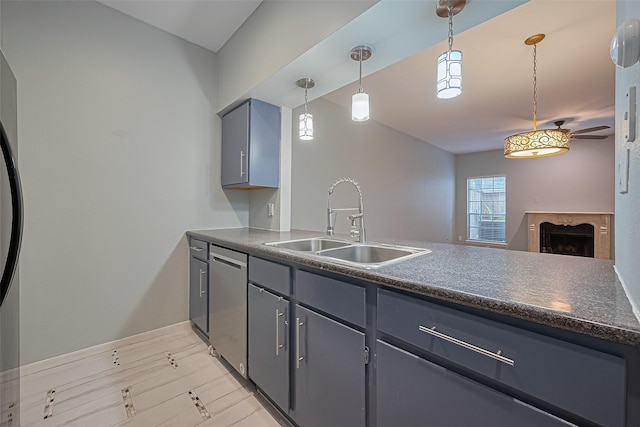 4001 Tanglewilde St Unit 1402, Houston, TX 77063 - kitchen featuring dishwasher, dark countertops, a fireplace, hanging light fixtures, and gray cabinetry