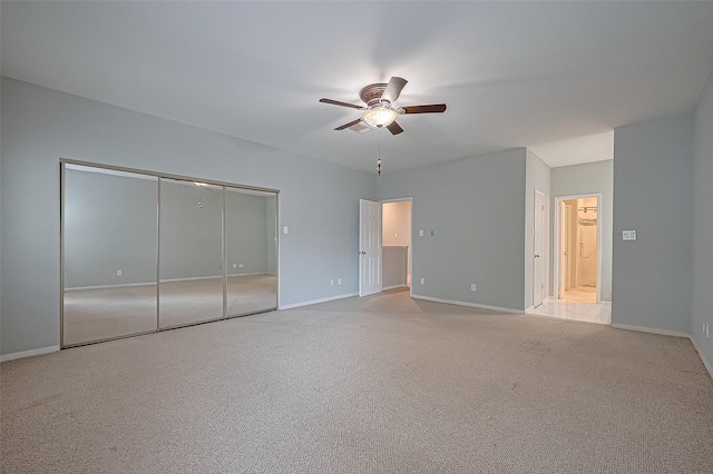 4001 Tanglewilde St Unit 1402, Houston, TX 77063 - unfurnished bedroom featuring carpet, a ceiling fan, and a closet