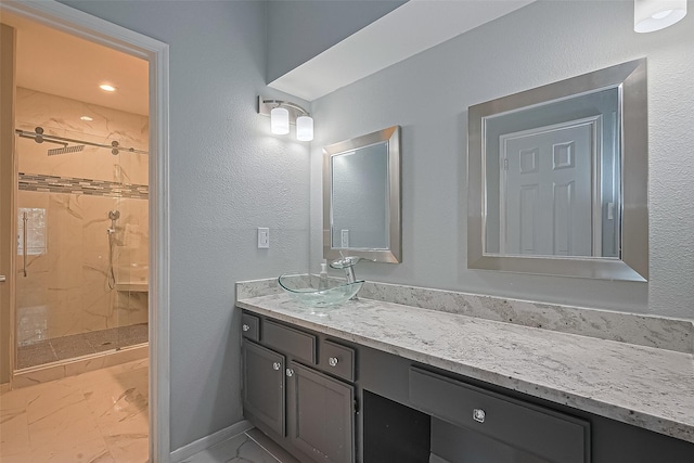 4001 Tanglewilde St Unit 1402, Houston, TX 77063 - bathroom featuring a marble finish shower, vanity, and marble finish floors