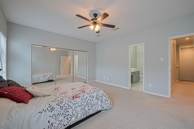 4001 Tanglewilde St Unit 1402, Houston, TX 77063 - bedroom with a closet, carpet, ensuite bathroom, and ceiling fan