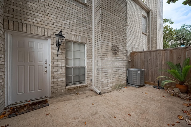 4001 Tanglewilde St Unit 1402, Houston, TX 77063 - doorway to property with brick siding