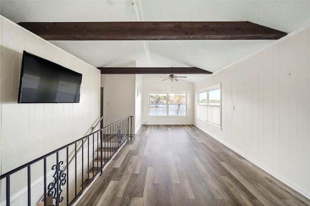 13318 Southshore Dr, Conroe, TX 77304 - unfurnished living room featuring wood finished floors, ceiling fan, and wooden walls