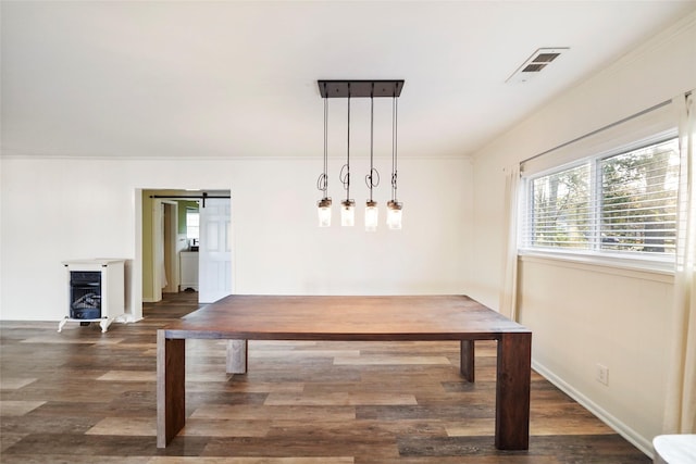 13318 Southshore Dr, Conroe, TX 77304 - unfurnished dining area featuring crown molding, dark wood-style floors, and a barn door