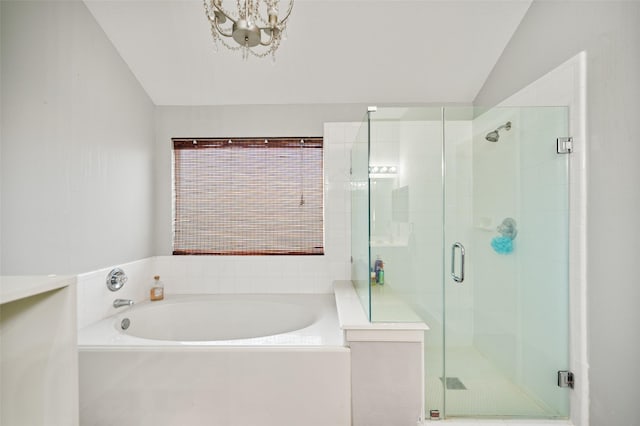 5726 Straight Way, Houston, TX 77339 - bathroom with a garden tub, a stall shower, a chandelier, and vaulted ceiling