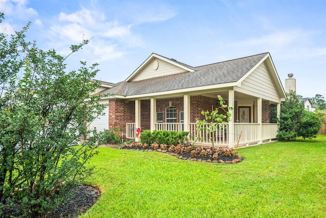 5726 Straight Way, Houston, TX 77339 - view of front of property with brick siding, a porch, roof with shingles, and a front yard
