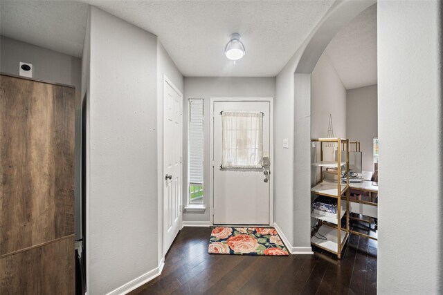 5726 Straight Way, Houston, TX 77339 - entrance foyer with arched walkways, wood-type flooring, and healthy amount of natural light