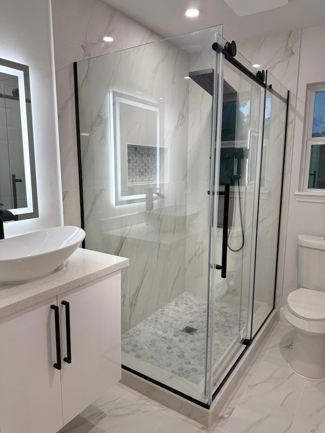 25907 Maplewood Dr, Spring, TX 77386 - full bathroom featuring marble finish flooring, vanity, a marble finish shower, and recessed lighting