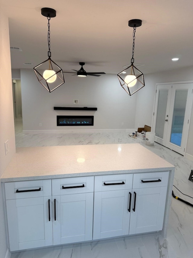 25907 Maplewood Dr, Spring, TX 77386 - kitchen with light marble finish flooring, ceiling fan, pendant lighting, and recessed lighting