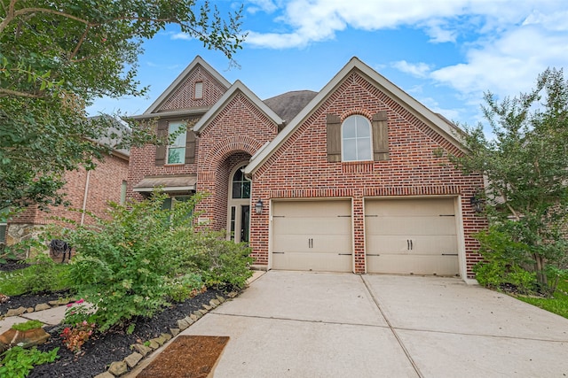 10022 Foggy Riv, Missouri City, TX 77459 - traditional home featuring brick siding, driveway, and a garage