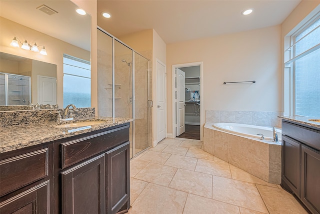 10022 Foggy Riv, Missouri City, TX 77459 - full bath featuring vanity, a stall shower, a bath, tile patterned floors, and recessed lighting