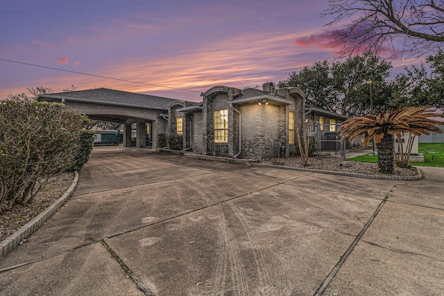 1454 Oday, Pearland, TX 77581 - view of front facade with driveway, a carport, brick siding, and a gate