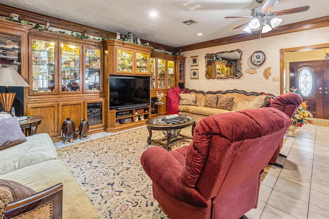 1454 Oday, Pearland, TX 77581 - living room with light tile patterned floors, a ceiling fan, ornamental molding, a textured ceiling, and recessed lighting