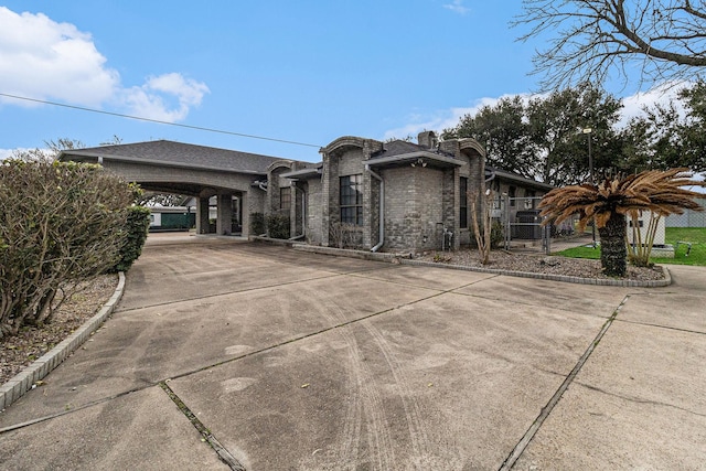 1454 Oday, Pearland, TX 77581 - view of front of home featuring concrete driveway and a carport