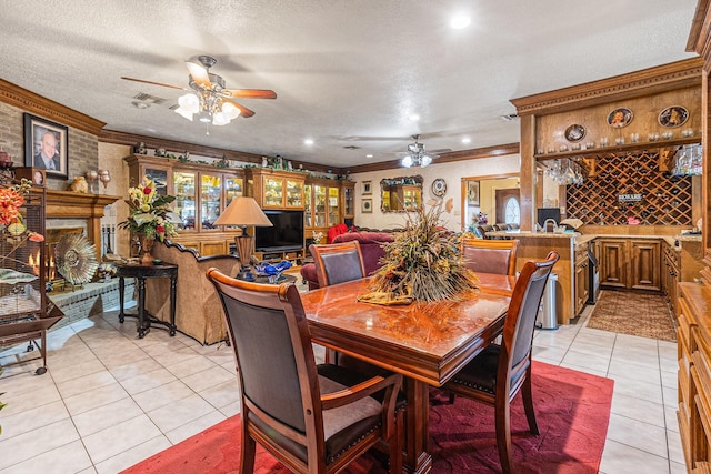 1454 Oday, Pearland, TX 77581 - dining area with ceiling fan, light tile patterned floors, crown molding, a textured ceiling, and recessed lighting