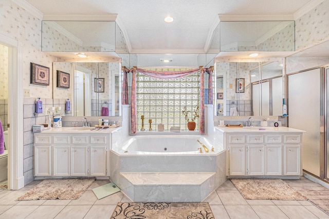 1454 Oday, Pearland, TX 77581 - bathroom with ornamental molding, wallpapered walls, a jetted tub, two vanities, and tile patterned flooring