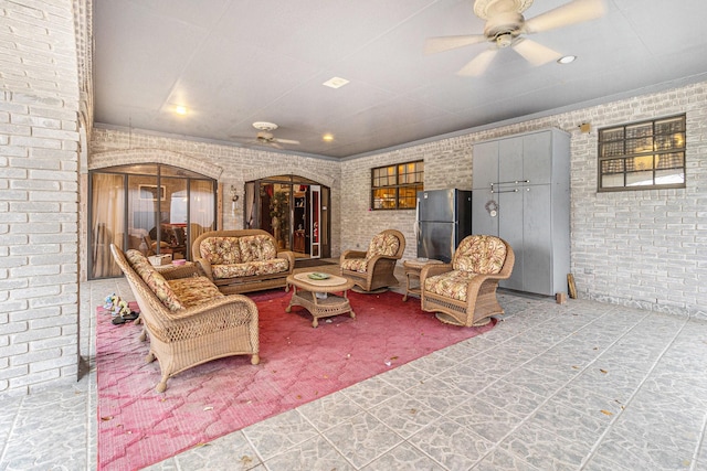 1454 Oday, Pearland, TX 77581 - living area with ceiling fan, brick wall, arched walkways, and recessed lighting