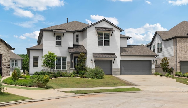 17907 Aqua Haven Ln, Conroe, TX 77302 - view of front of property with concrete driveway, a front lawn, a standing seam roof, and a shingled roof