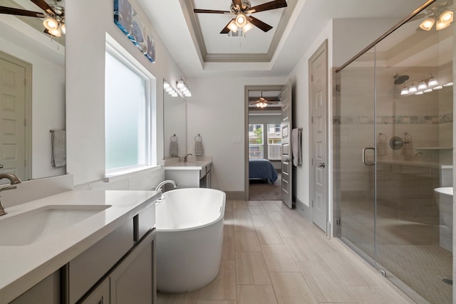 17907 Aqua Haven Ln, Conroe, TX 77302 - bathroom with a ceiling fan, vanity, a soaking tub, ensuite bathroom, and a shower stall