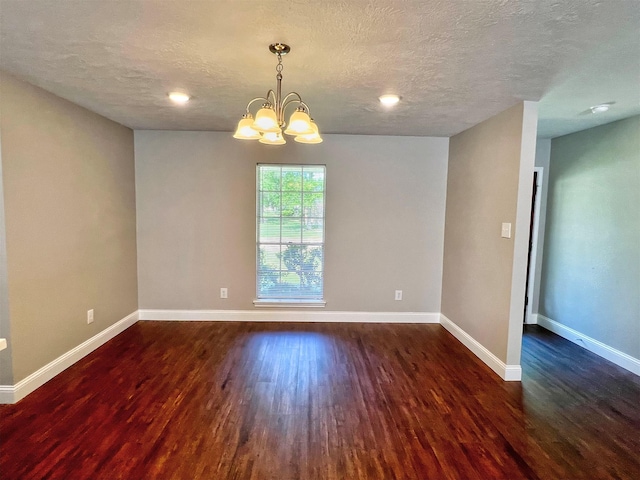 415 Sevenhampton Ln, Houston, TX 77015 - spare room featuring wood finished floors, a chandelier, and a textured ceiling