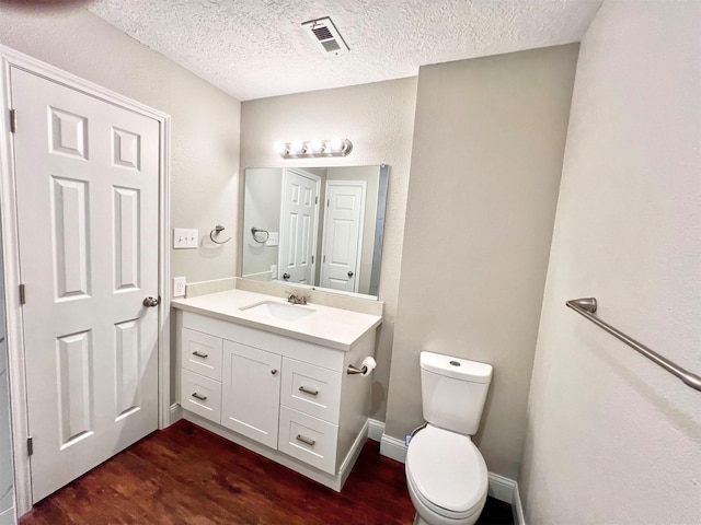 415 Sevenhampton Ln, Houston, TX 77015 - half bath featuring wood finished floors, vanity, and a textured ceiling