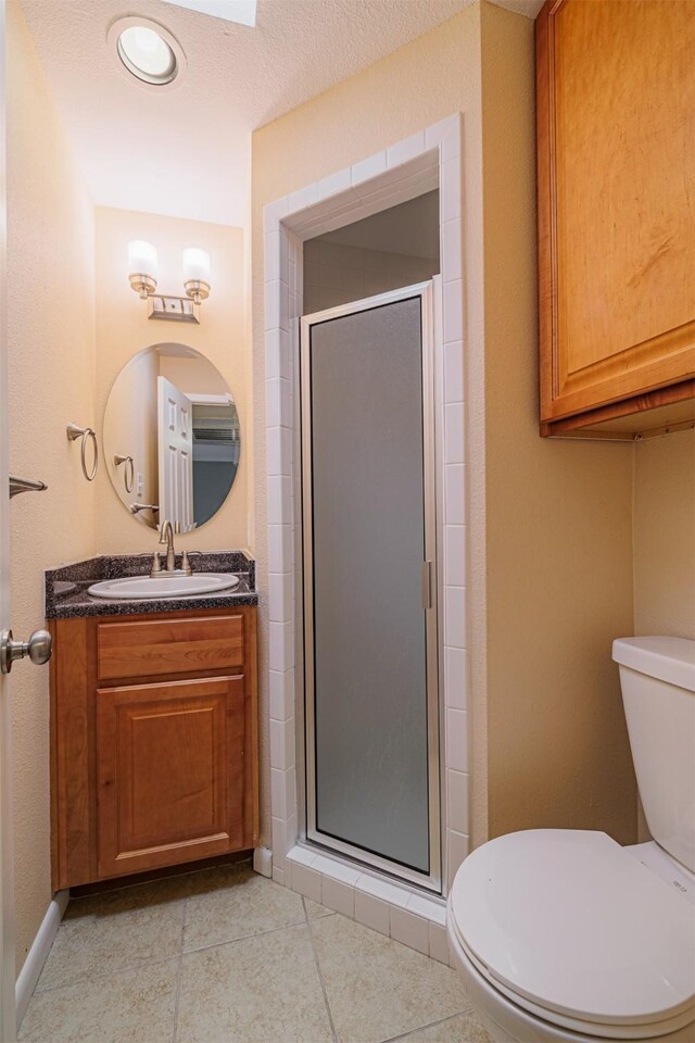 2621 Marilee Ln Unit 3, Houston, TX 77057 - bathroom featuring vanity, a shower stall, tile patterned floors, and recessed lighting
