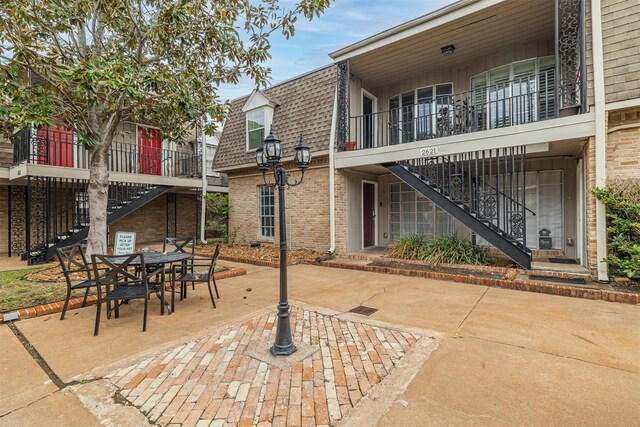 2621 Marilee Ln Unit 3, Houston, TX 77057 - view of patio with stairs and outdoor dining space