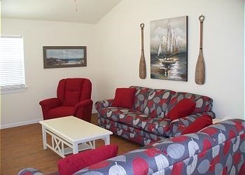 1310 Seashell Dr, Surfside Beach, TX 77541 - living area with wood finished floors and lofted ceiling