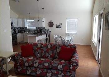 1310 Seashell Dr, Surfside Beach, TX 77541 - living room with baseboards and light wood finished floors