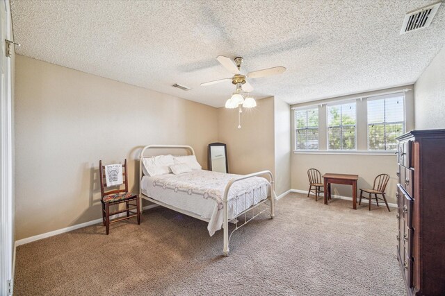 16063 Hidden Acres Dr, Houston, TX 77084 - carpeted bedroom with ceiling fan and a textured ceiling