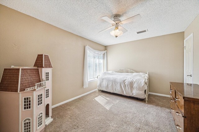 16063 Hidden Acres Dr, Houston, TX 77084 - carpeted bedroom featuring a textured ceiling and ceiling fan