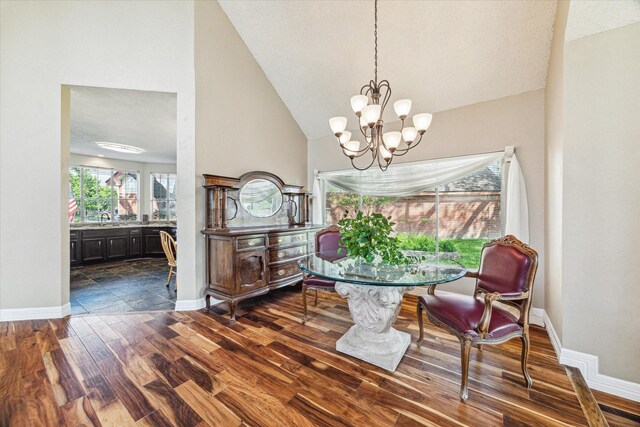 16063 Hidden Acres Dr, Houston, TX 77084 - dining area featuring a chandelier, dark wood finished floors, and high vaulted ceiling