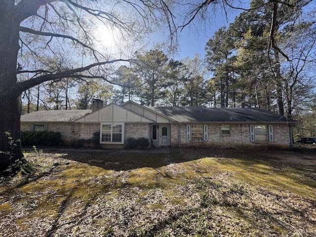 447 Plum Creek Rd, Longview, TX 75605 - ranch-style house featuring brick siding and a chimney