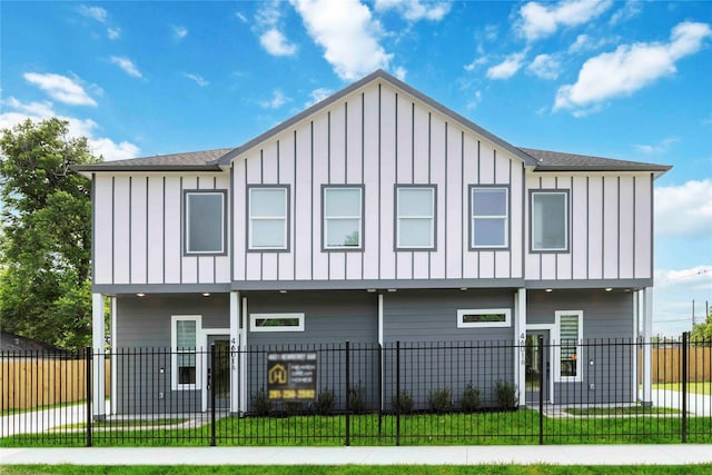 4601 Newberry St A/B, Unit A/B Houston, TX 77051 - view of front of house featuring board and batten siding and a fenced front yard