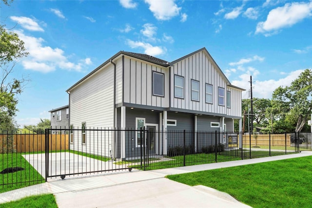 4601 Newberry St A/B, Unit A/B Houston, TX 77051 - view of side of property with board and batten siding, a fenced front yard, and driveway