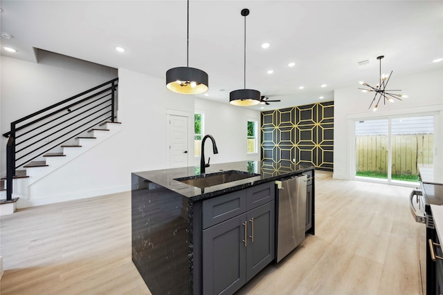 4601 Newberry St A/B, Unit A/B Houston, TX 77051 - kitchen with light wood-style floors, dark stone counters, recessed lighting, hanging light fixtures, and gray cabinets