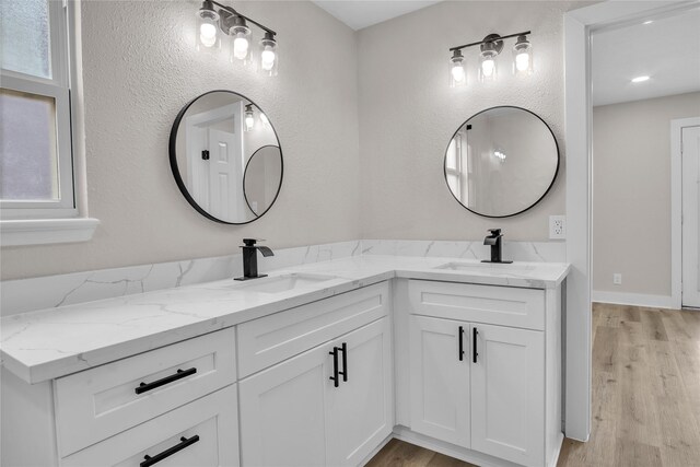 38 N Flamingo St, La Marque, TX 77568 - full bath with double vanity and wood finished floors