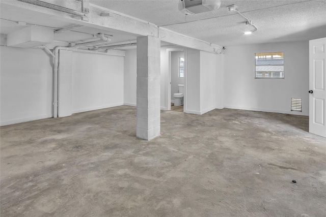 38 N Flamingo St, La Marque, TX 77568 - basement with a textured ceiling