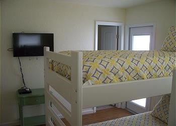 1314 Seashell Dr, Surfside Beach, TX 77541 - bedroom with wood finished floors