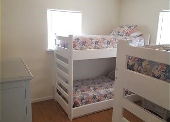 1314 Seashell Dr, Surfside Beach, TX 77541 - bedroom featuring wood finished floors