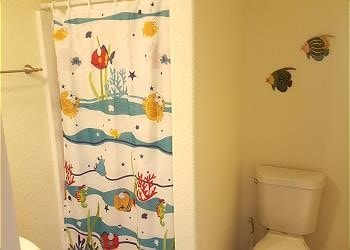 1314 Seashell Dr, Surfside Beach, TX 77541 - full bath featuring toilet and a shower with shower curtain