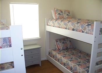 1314 Seashell Dr, Surfside Beach, TX 77541 - bedroom featuring wood finished floors