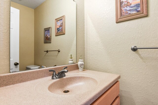 115 Southwind Dr, Surfside Beach, TX 77541 - bathroom featuring vanity and toilet