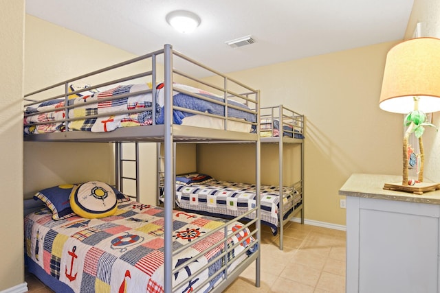 115 Southwind Dr, Surfside Beach, TX 77541 - bedroom with baseboards and light tile patterned floors