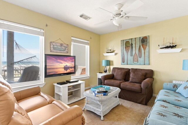 115 Southwind Dr, Surfside Beach, TX 77541 - living room with tile patterned flooring and ceiling fan